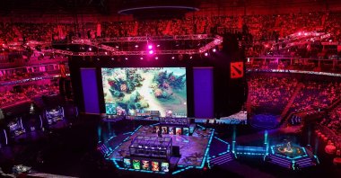 Spectators watch the Dota 2 eSports Best of 5 final match between team OG and team Liquid during the International Dota 2 Championships in Shanghai, China, Aug. 25, 2019. (AFP Photo)

