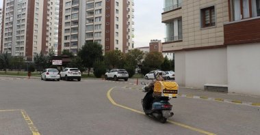 A motorcycle courier drives on a street in Diyarbakır, southeastern Turkey, Jan. 9, 2021. (AA Photo)