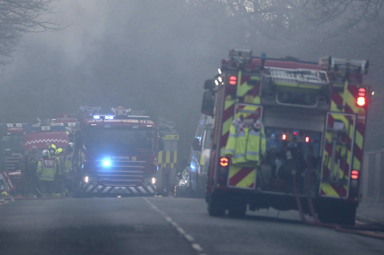 Emergency services responding to a fire that broke out at Napier Barracks where asylum seekers are housed in Folkestone, southern England, Friday Jan. 29, 2021.  (Gareth Fuller/PA via AP)
