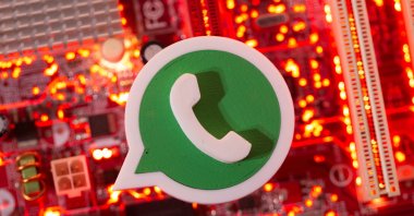 A 3D printed Whatsapp logo is placed on a computer motherboard in this illustration created on Jan. 21, 2021. (Reuters Photo)
