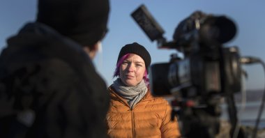 Lisa Enroth is interviewed by the Associated Press, on the island of Hamneskar, western Sweden on Saturday, Jan. 30, 2021. (AP Photo/Thomas Johansson)