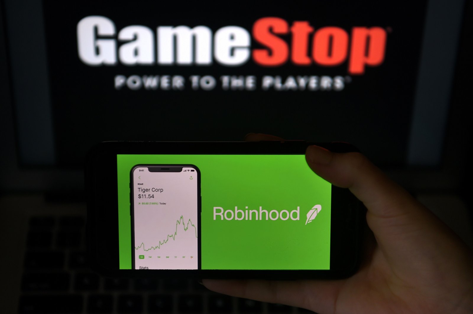 This photo illustration shows the logos of the video game retail store GameStop and the trading application Robinhood, Arlington, Virginia, the U.S., Jan. 28, 2021. (AFP Photo)