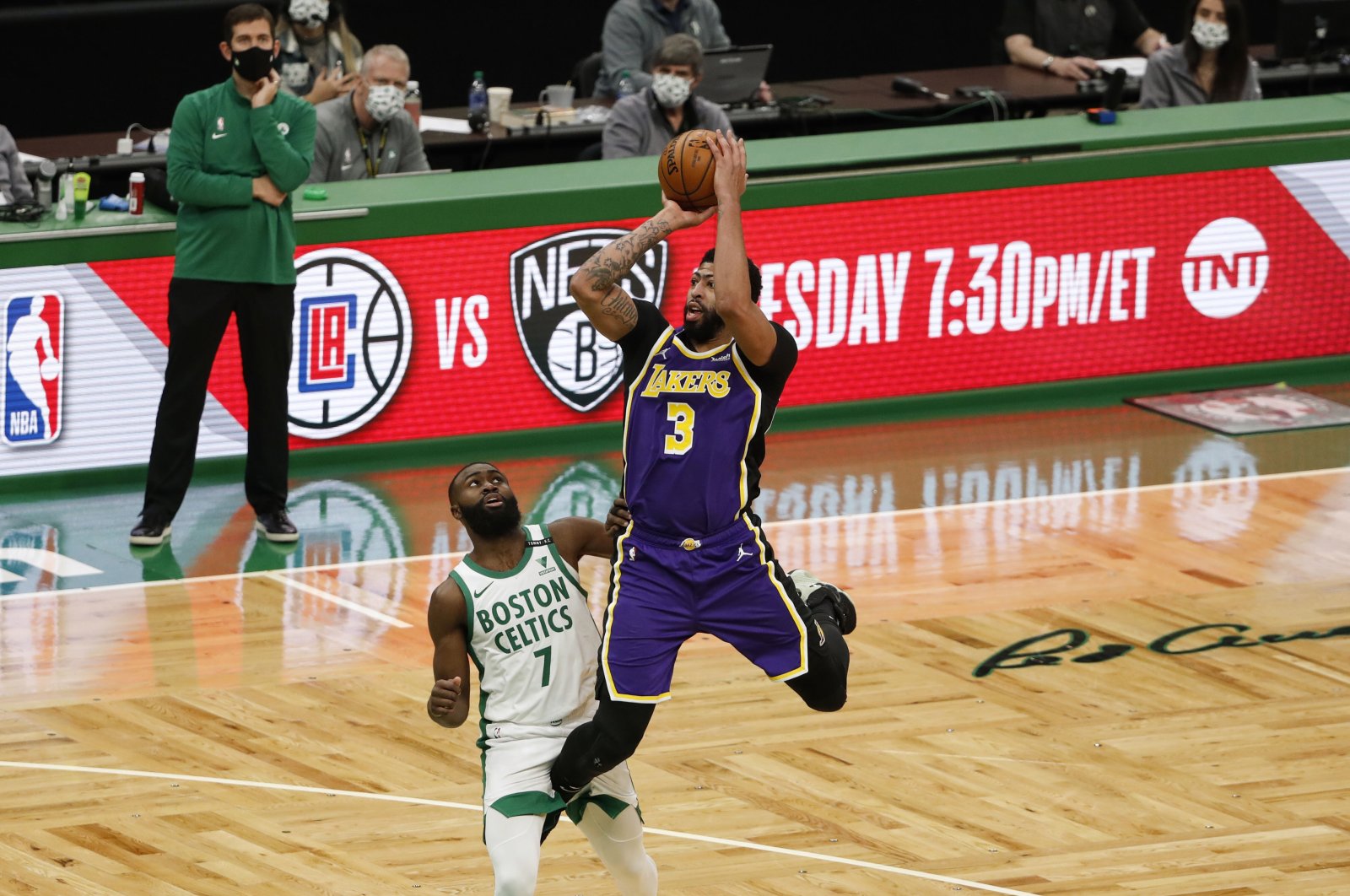 Los Angeles Lakers forward Anthony Davis (R) shoots over Boston Celtics guard Jaylen Brown (L) during the third quarter at TD Garden, Boston, U.S., Jan 30, 2021. (Reuters Photo)