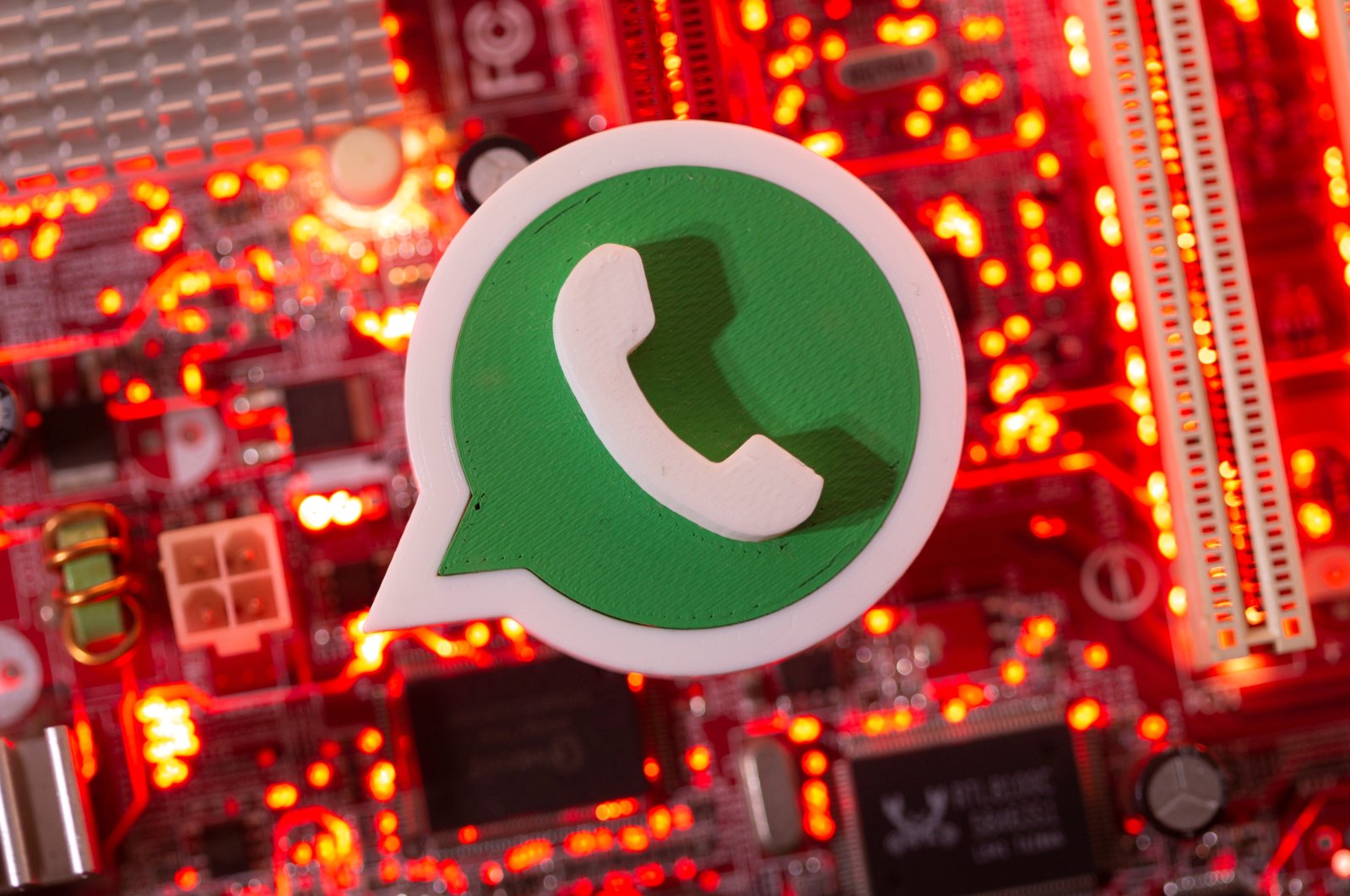 A 3D printed Whatsapp logo is placed on a computer motherboard in this illustration created on Jan. 21, 2021. (Reuters Photo)