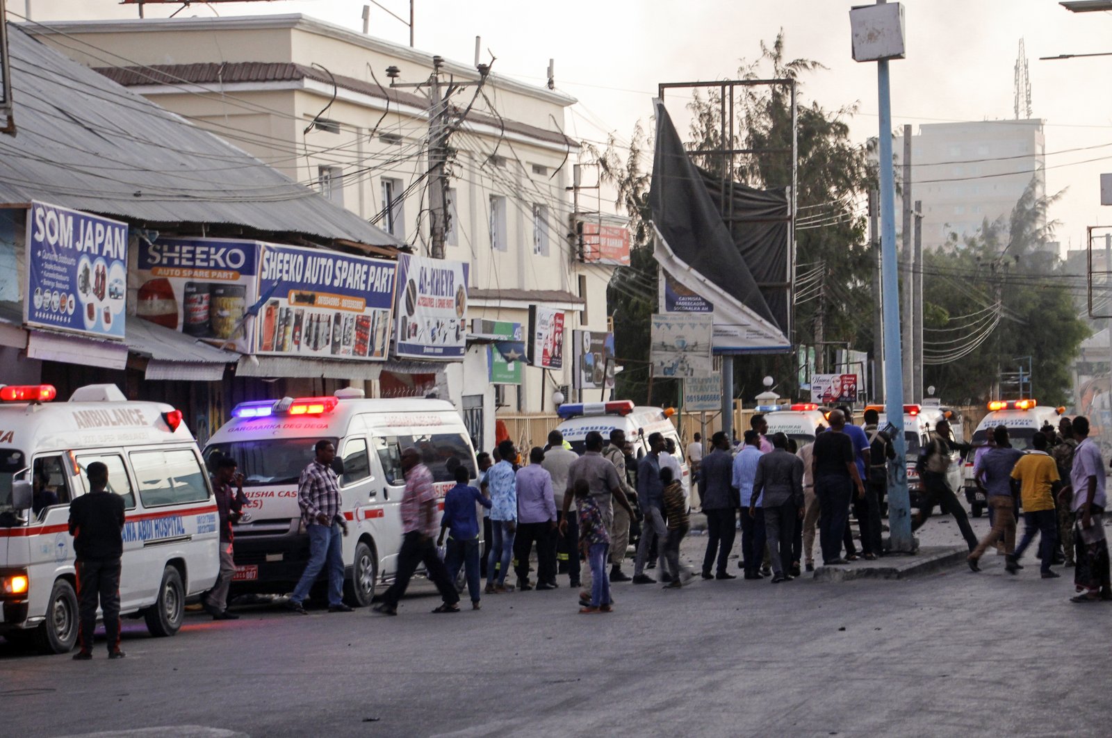 Ambulances and security forces gather on the street outside the Afrik hotel in the capital Mogadishu, Somalia, Jan. 31, 2021. (AP Photo)
