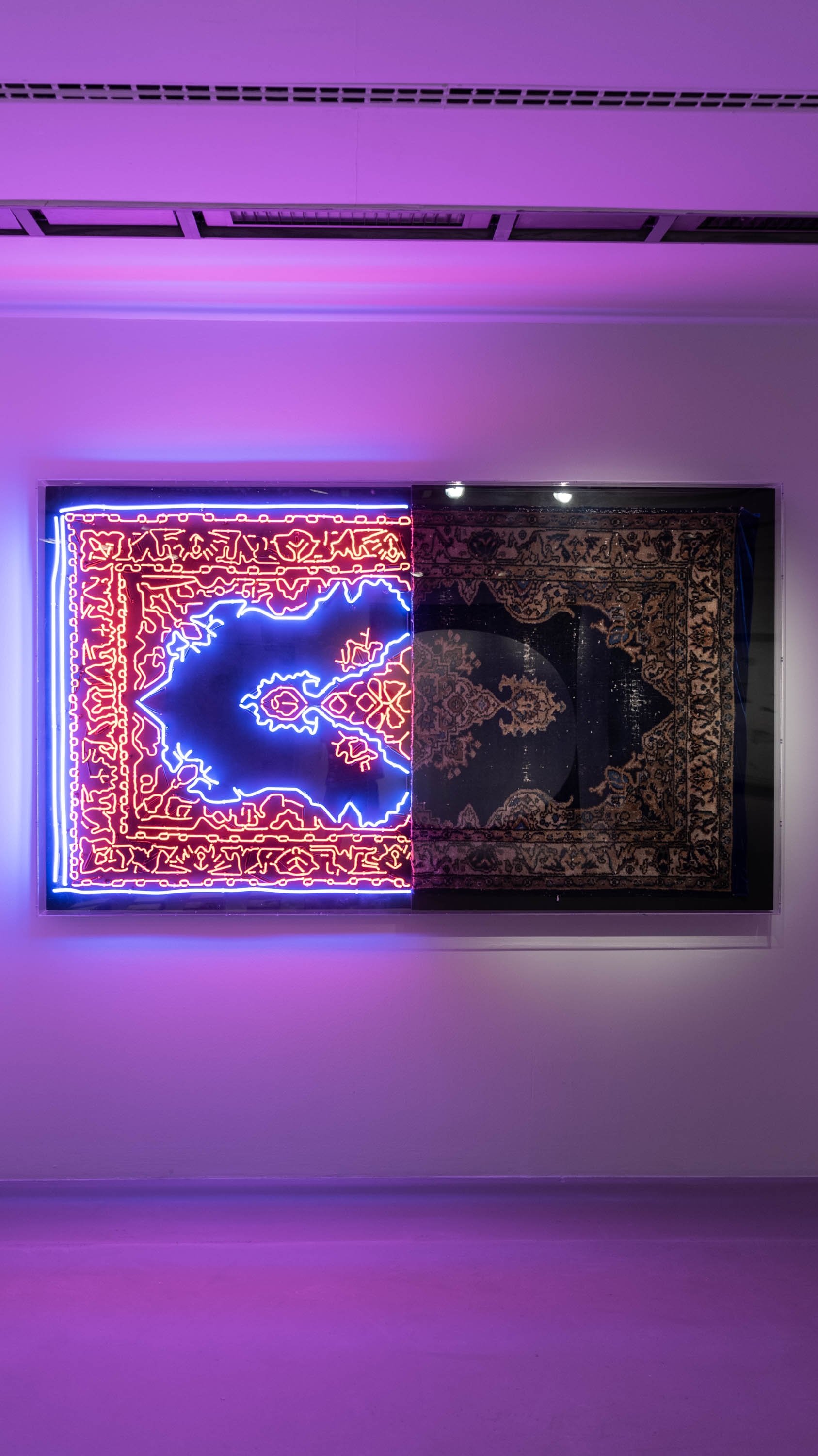 Ramazan Can, 'Feel at Home,' 2020, neon, carpet, wood, Plexiglass. (Courtesy of Akbank Sanat) 