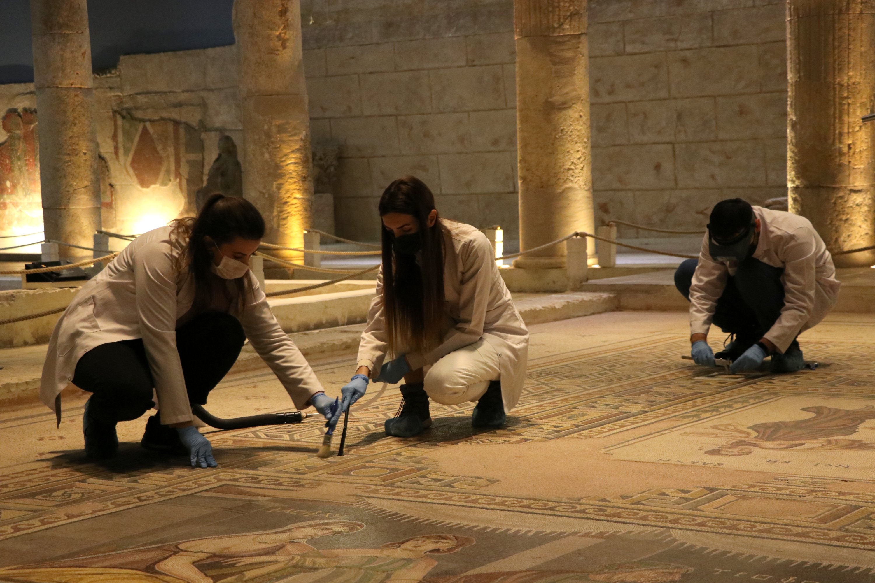 Experts clean mosaics at the Zeugma Mosaic Museum, Gaziantep, southeastern Turkey, Jan. 29, 2021. (AA Photo)