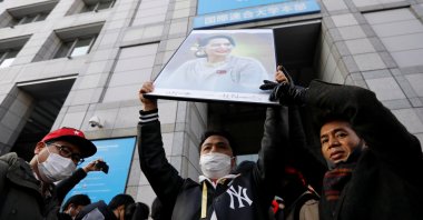 Protesters from Myanmar residing in Japan hold a portrait of leader Aung San Suu Kyi at a rally against Myanmar's military after it seized power from a democratically elected civilian government and arrested Suu Kyi, at United Nations University in Tokyo, Japan, Feb. 1, 2021. (Reuters Photo)