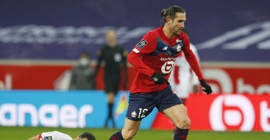 Lille's Turkish midfielder Yusuf Yazici (R) goes past Dijon's Wesley Lautoa, Stade Pierre-Mauroy, Lille, France, Jan. 31, 2021. (Reuters Photo)