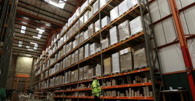An employee looks up at goods at the Miniclipper Logistics warehouse in Leighton Buzzard, Britain, Dec. 3, 2018. (Reuters Photo)