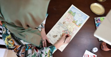 Ayşe Yıldırım paints a miniature at her workshop in Istanbul, Turkey, Jan. 31, 2020. (AA Photo)
