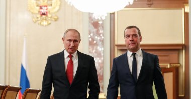 Russian President Vladimir Putin and then-Prime Minister Dmitry Medvedev walk before a meeting with members of the government in Moscow, Russia, Jan. 15, 2020. (AFP Photo)