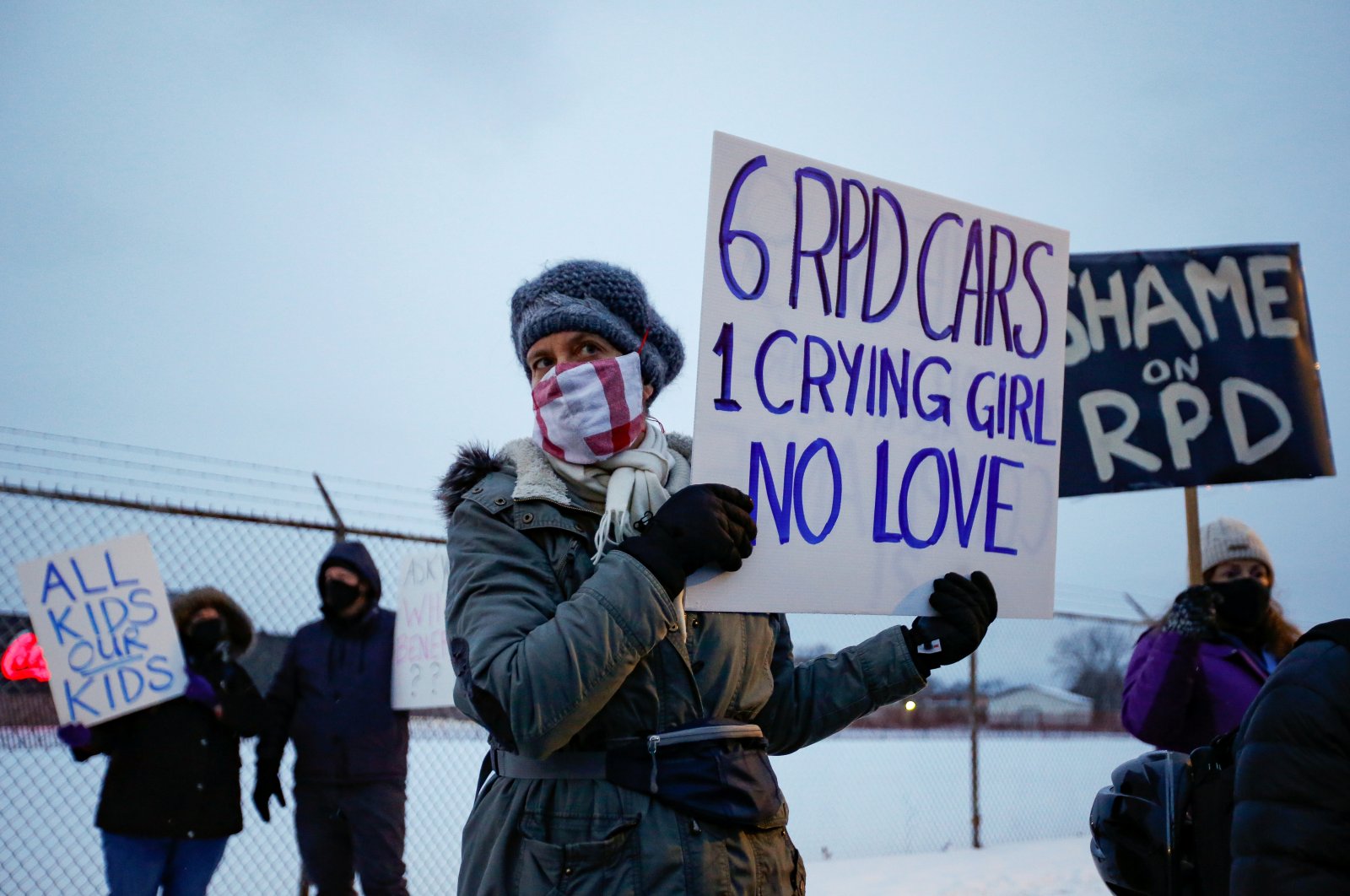 People protest the police's use of excessive force after a nine-year-old girl was handcuffed and sprayed with a chemical irritant in Rochester, New York, U.S., Feb. 1, 2021. (Reuters Photo)