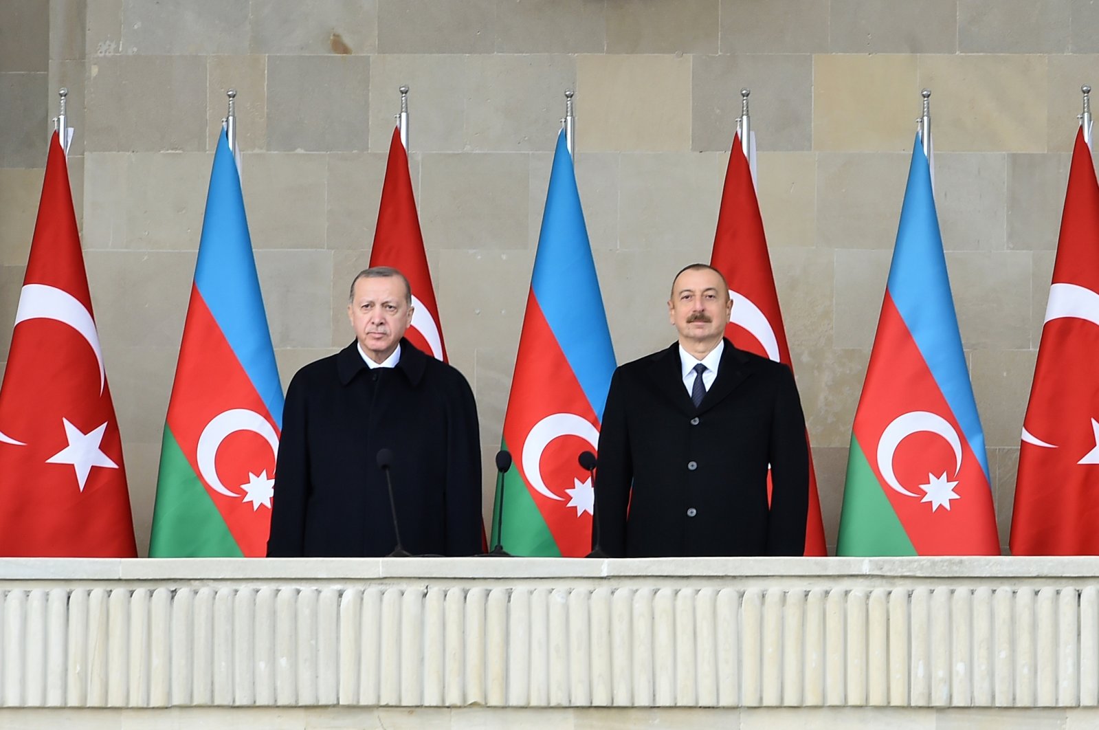 Turkish President Recep Tayyip Erdoğan (L) and Azerbaijani President Ilham Aliyev attend a military parade celebrating Azerbaijan's victory in the Nagorno-Karabakh armed conflict, in Baku, Azerbaijan, Dec. 10, 2020. (EPA-EFE Photo)
