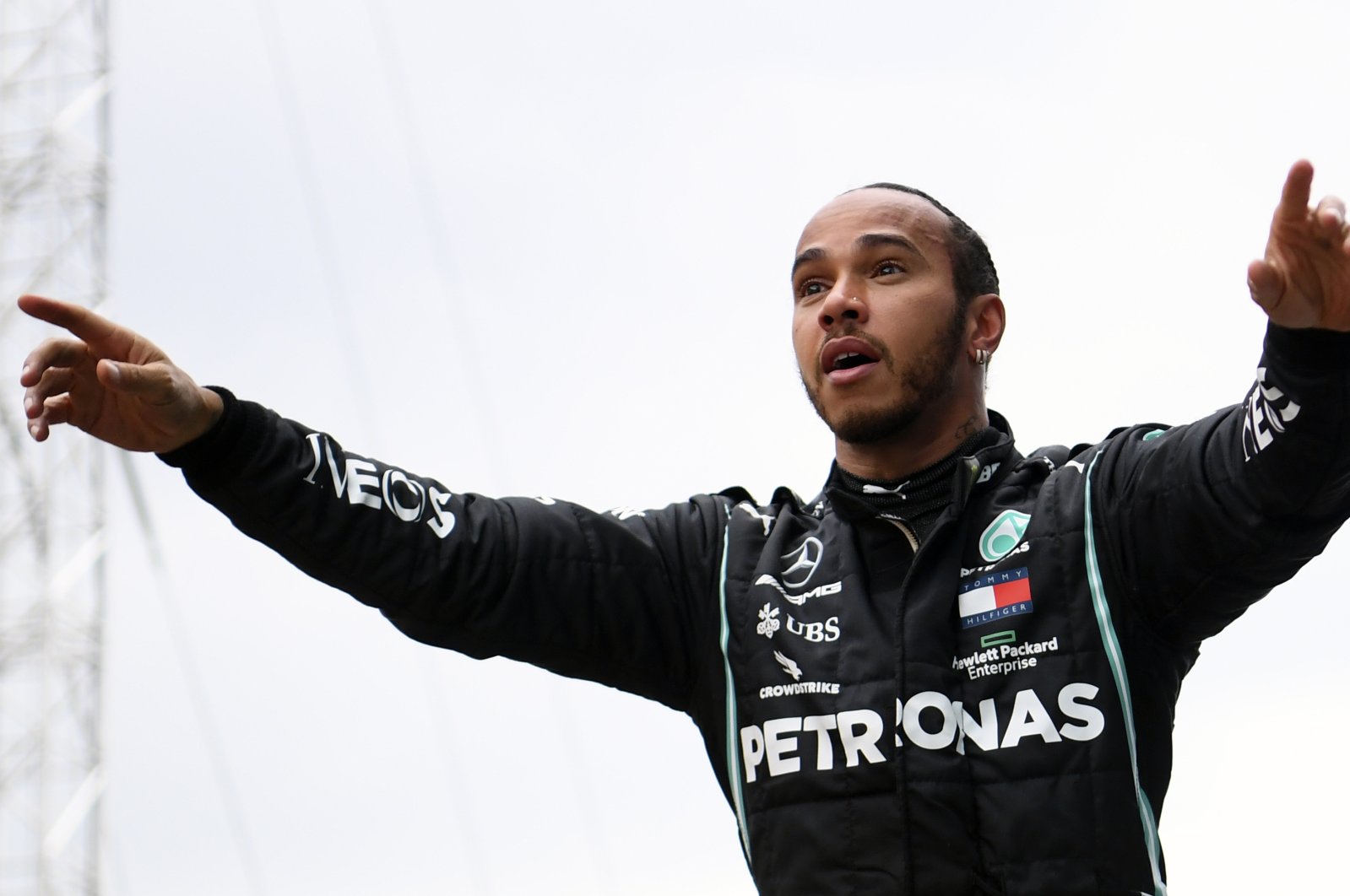 Mercedes driver Lewis Hamilton of Britain celebrates after winning the Turkish Formula One Grand Prix at the Istanbul Park circuit racetrack in Istanbul, Sunday, Nov. 15, 2020. (AP Photo)