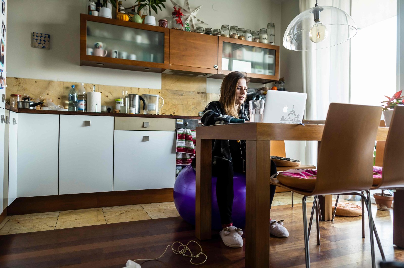 Anna Brymora is seen providing online lessons from the kitchen of her apartment in Warsaw, on Jan. 18, 2021. (AFP Photo)