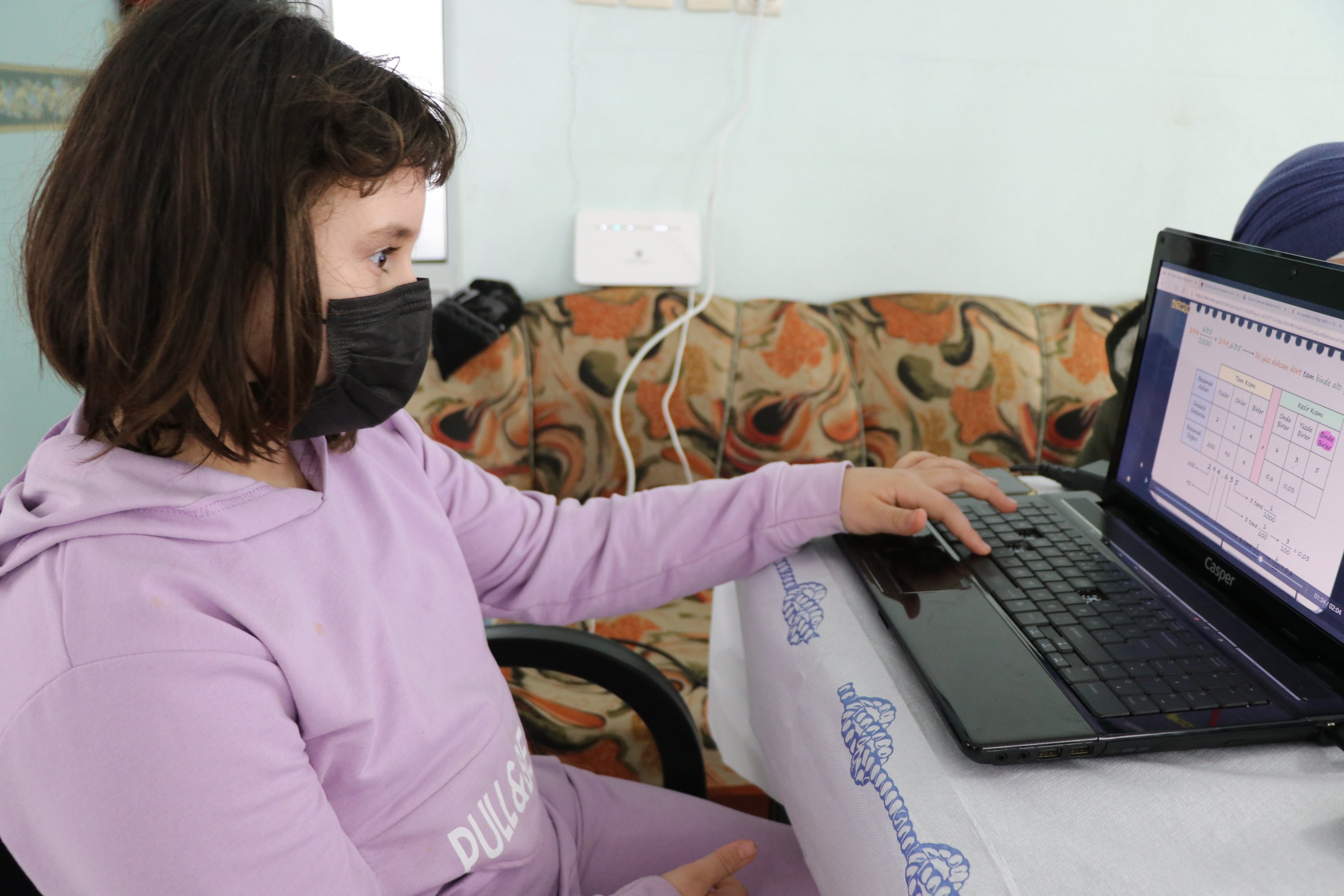 A schoolgirl completes her lessons on a laptop in Bayramlı village, Uzunköprü district, Edirne province, northwestern Turkey, Jan. 13, 2021. (AA Photo)