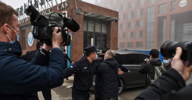 Members of the World Health Organization (WHO) team investigating the origins of the COVID-19 coronavirus, arrive at the Wuhan Institute of Virology in Wuhan, in China's central Hubei province on Feb. 3, 2021. (AFP Photo)