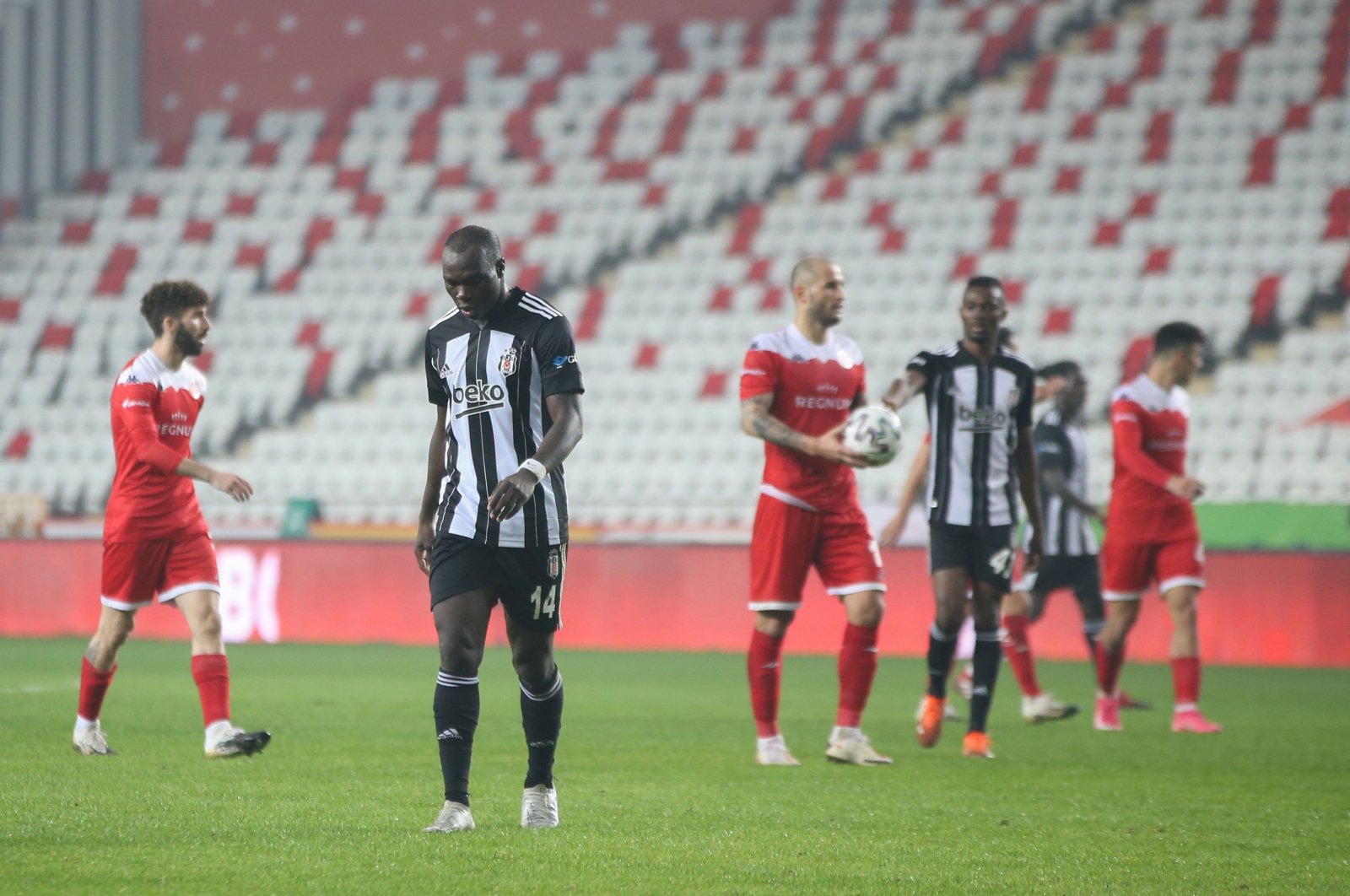 Beşiktaş's Vincent Aboubakar (2-L) walks out of the pitch at the end of the Turkish Süper Lig match in Antalya, Feb. 3, 2021 (AA Photo)