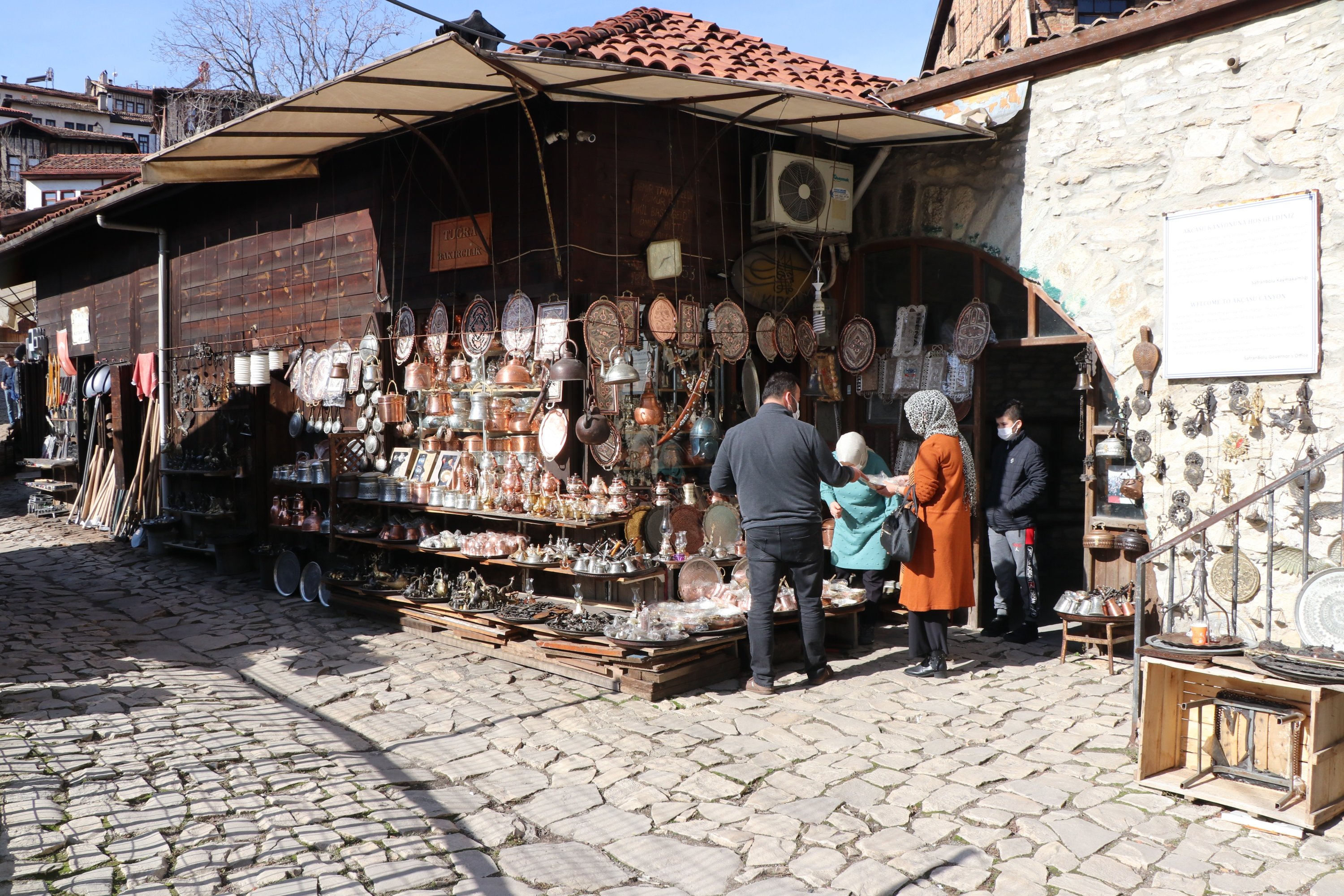 People shop at the Blacksmiths Market in the Safranbolu district of Karabük, northern Turkey, Feb. 3, 2021. (IHA Photo)