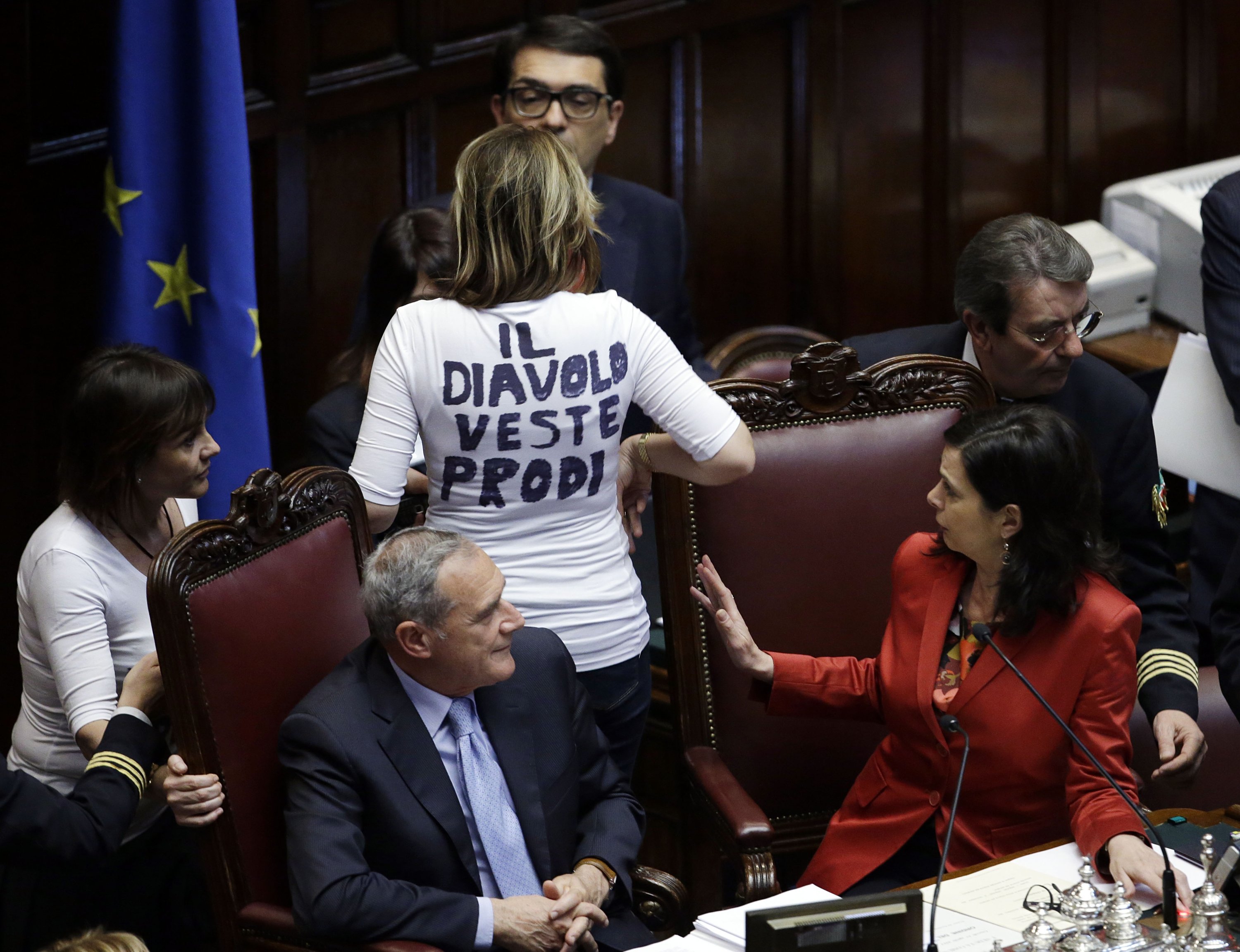 Senator Alessandra Mussolini (top C) shows a T-shirt that reads "The Devil wears Prodi" to Senate President Pietro Grasso (L) and Lower Chamber President Laura Boldrini during the fourth round of voting to elect a new president, in Rome, April 19, 2013. (AP Photo)