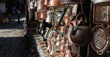 Various metal teapots and pitchers are on display at one of the workshops of the Blacksmiths Market in the Safranbolu district of Karabük, northern Turkey, Feb. 3, 2021. (IHA Photo)