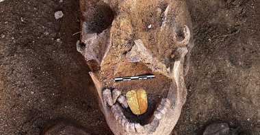 A 2,000-year-old mummy with a gold foil amulet inside his mouth is seen at the Taposiris Magna Temple in western Alexandria, Egypt, Jan. 29, 2021. (Egyptian Ministry of Antiquities via AFP)