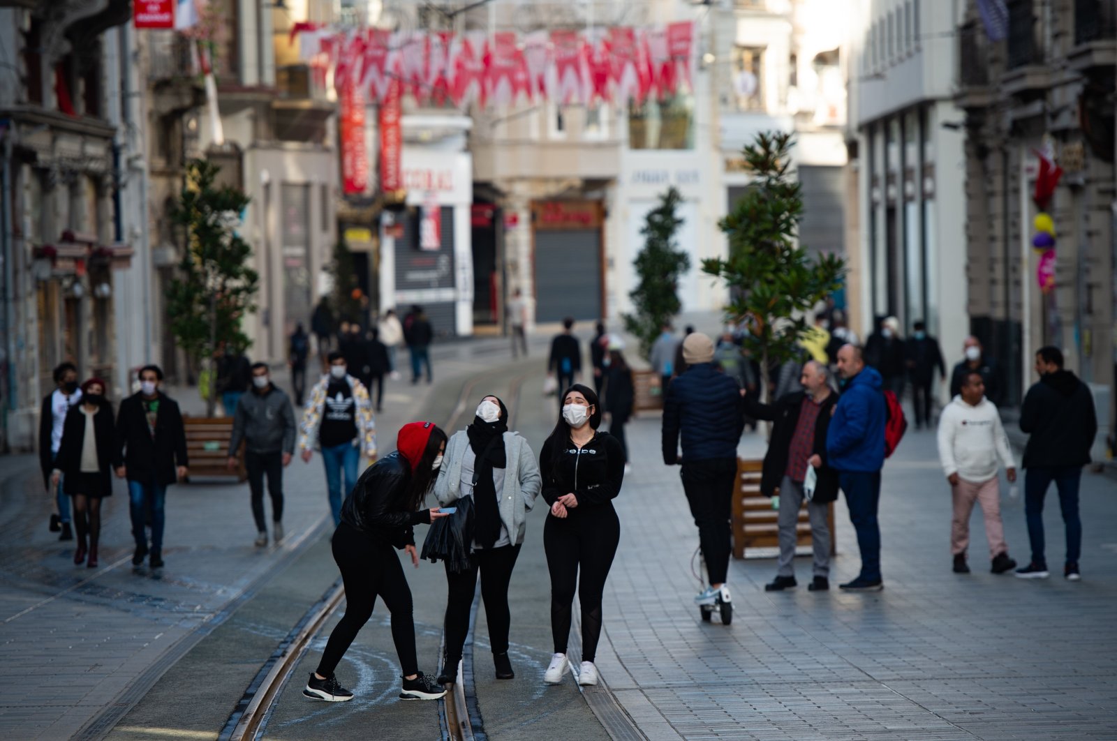 People walk on Istiklal Avenue, in Istanbul, Turkey, Jan. 31, 2021. (AFP Photo)