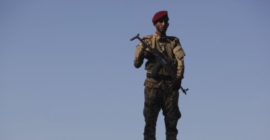 A soldier allied to Yemen's internationally recognized government stands guard at the port of Aden in Aden, Yemen, Dec. 12, 2018. (AP Photo)