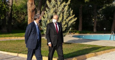 Turkish Republic of Northern Cyprus (TRNC) President Ersin Tatar walks with British Foreign Secretary Dominic Raab in Lefkoşa, TRNC on Feb. 4, 2021. (AA Photo)