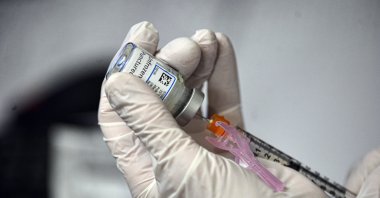 A nurse at Brattleboro Memorial Hospital draws the Moderna COVID-19 vaccine into a syringe in Brattleboro, Vermont, U.S., Feb. 3, 2021. (The Brattleboro Reformer via AP)