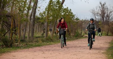 Citizens ride bikes in a park in the western province of Izmir, Turkey, Feb. 5, 2021. (AA Photo)