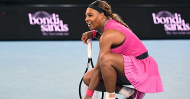 Serena Williams kneels during a break in action against Danielle Collins during their match at the Yarra Valley Classic, Melbourne, Australia, Feb. 5, 2021. (EPA Photo)