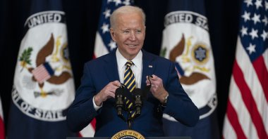 U.S. President Joe Biden smiles as he arrives to deliver remarks to State Department staff, Washington, D.C., U.S., Feb. 4, 2021. (AP Photo)