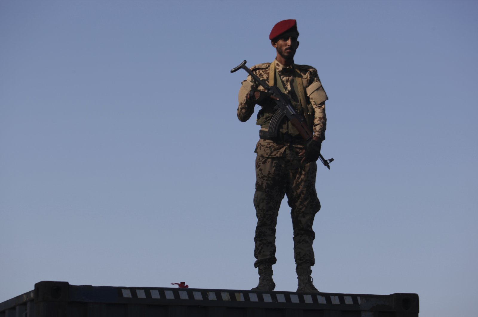 A soldier allied to Yemen's internationally recognized government stands guard at the port of Aden in Aden, Yemen, Dec. 12, 2018. (AP Photo)