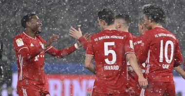 Bayern's Kingsley Coman, (L), celebrates after scoring his side's opening goal during the German Bundesliga soccer match between Hertha BSC Berlin and FC Bayern Munich in Berlin, Germany, Feb. 5, 2021. (Pool via AP)