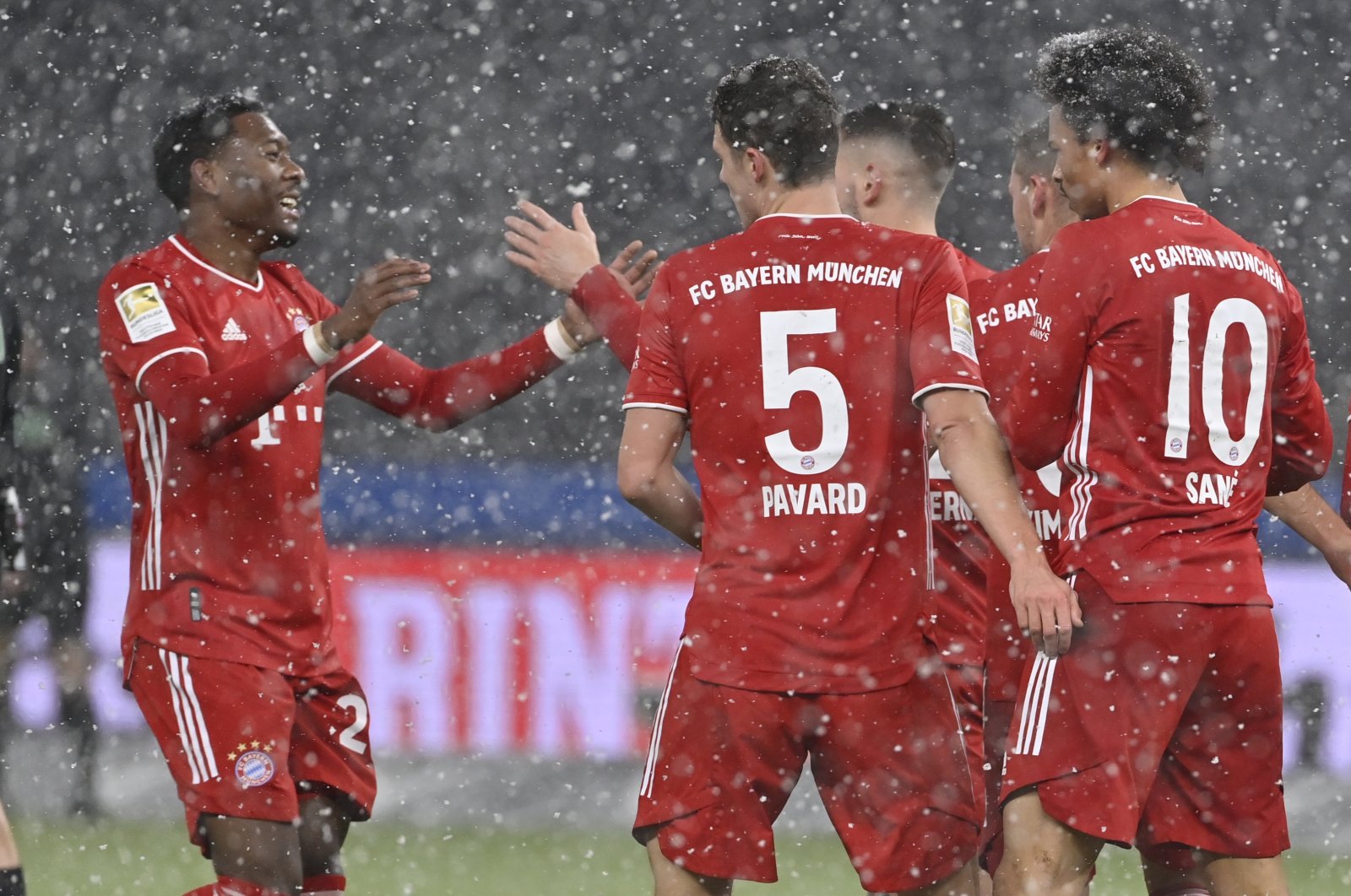 Bayern's Kingsley Coman, (L), celebrates after scoring his side's opening goal during the German Bundesliga soccer match between Hertha BSC Berlin and FC Bayern Munich in Berlin, Germany, Feb. 5, 2021. (Pool via AP)