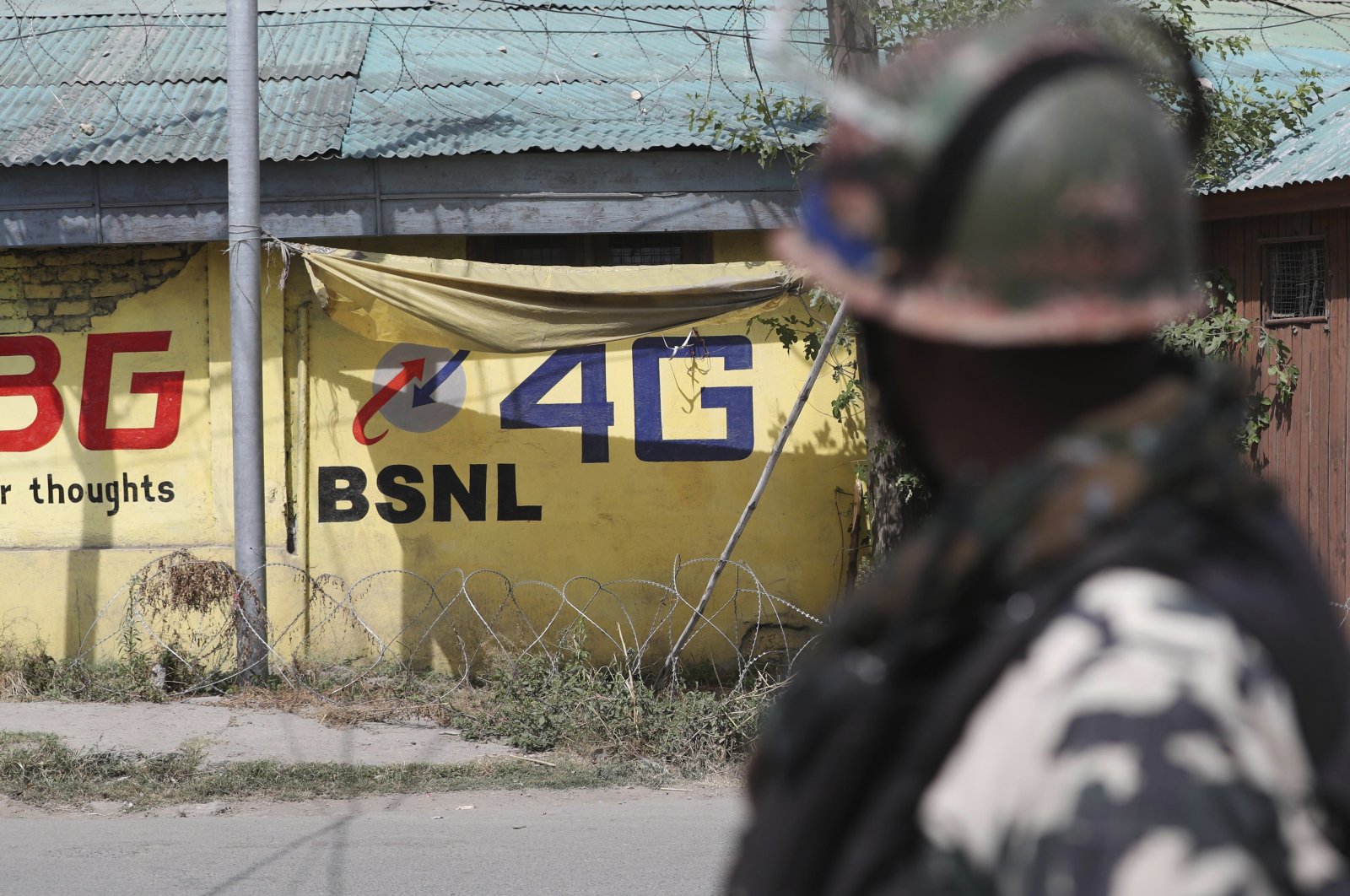An Indian paramilitary soldier keeps guard outside the main telephone exchange building in Srinagar, Indian controlled Kashmir, Sept. 5, 2019. (AP Photo)
