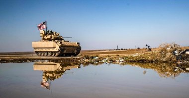 A U.S. Bradley Fighting Vehicle (BFV) patrols in the countryside near al-Malikiyah (Derik) in Syria's northeastern Hasakah province, Feb. 2, 2021. (AFP Photo)