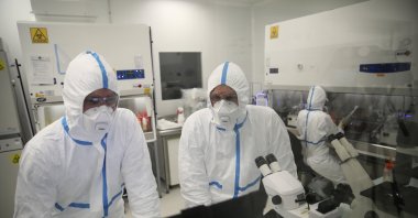 Laboratory technicians work at Valneva headquarters in Saint-Herblain, western France, Feb. 3, 2021. (AP Photo)