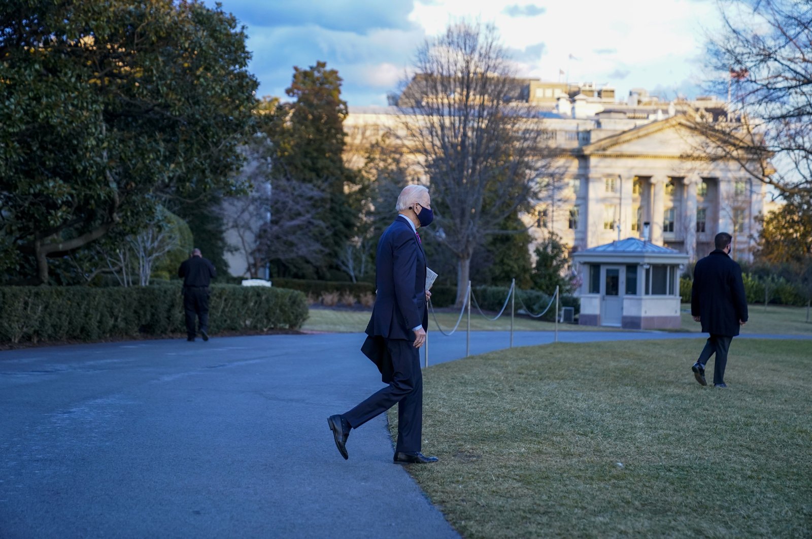 U.S. President Joe Biden walks aboard Marine One on the South Lawn of the White House, Washington, D.C., the U.S., Feb. 5, 2021. (AP Photo)