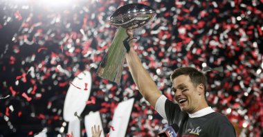 Tampa Bay Buccaneers quarterback Tom Brady (12) holds the Vince Lombardi trophy following the NFL Super Bowl 55 football game against the Kansas City Chiefs, Sunday, Feb. 7, 2021, in Tampa, Fla. Tampa Bay won 31-9. (Ben Liebenberg via AP)