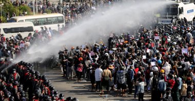 Police fire a water cannon at protesters demonstrating against the coup and demanding the release of elected leader Aung San Suu Kyi, in Naypyitaw, Myanmar, Feb. 8, 2021. (Reuters Photo)