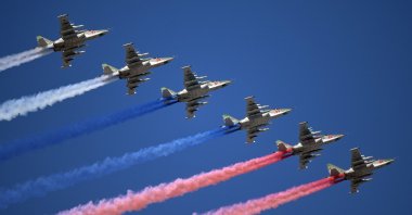 Su-25 jet fighters release smoke in the colors of the Russian state flag during the Navy Day parade in Saint Petersburg, Russia, July 26, 2020. (Reuters Photo)