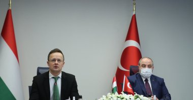 Hungarian Minister of Foreign Affairs and Trade Peter Szijjarto (L) and Turkey’s Industry and Technology Minister Mustafa Varank speak during a news conference, Ankara, Turkey, Feb. 8, 2021.