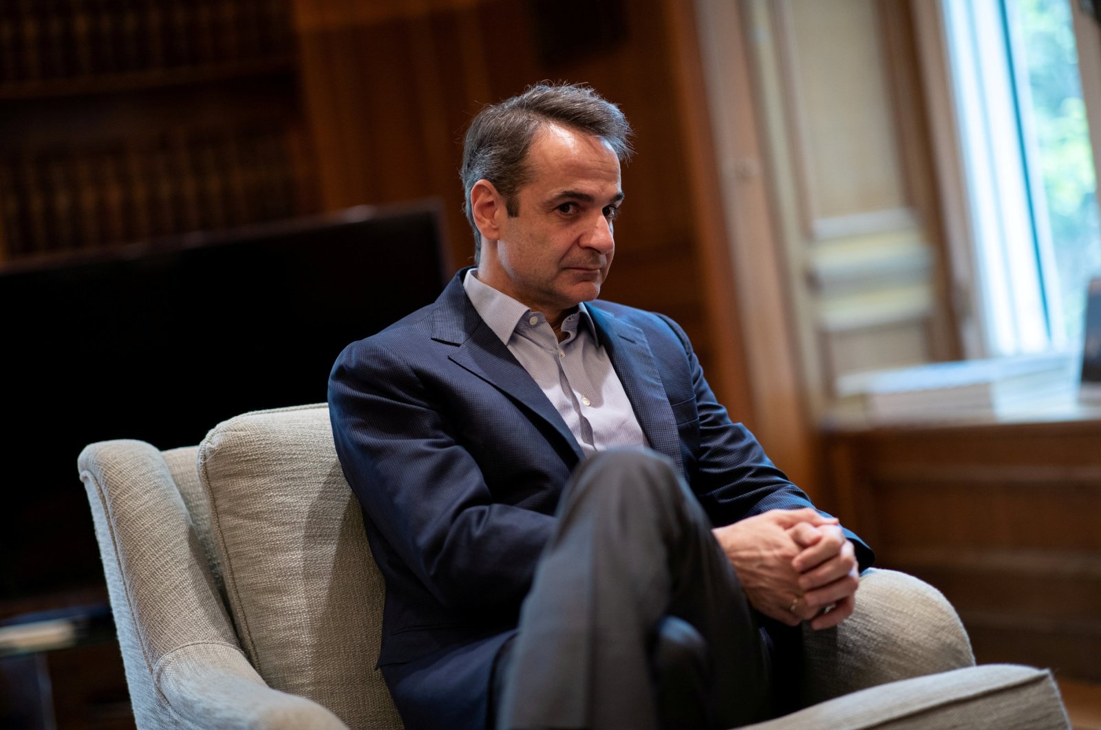 Greek Prime Minister Kyriakos Mitsotakis looks on before his meeting with Managing Director of the European Stability Mechanism Klaus Regling in his office in the Maximos Mansion in Athens, Greece, March 7, 2020. (Reuters Photo)
