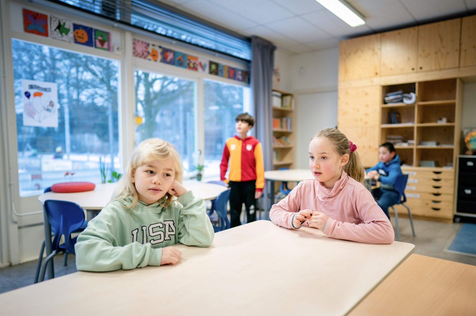 Children attend a class at a primary school in The Hague, Netherlands, Feb. 8, 2021. (AFP Photo) 