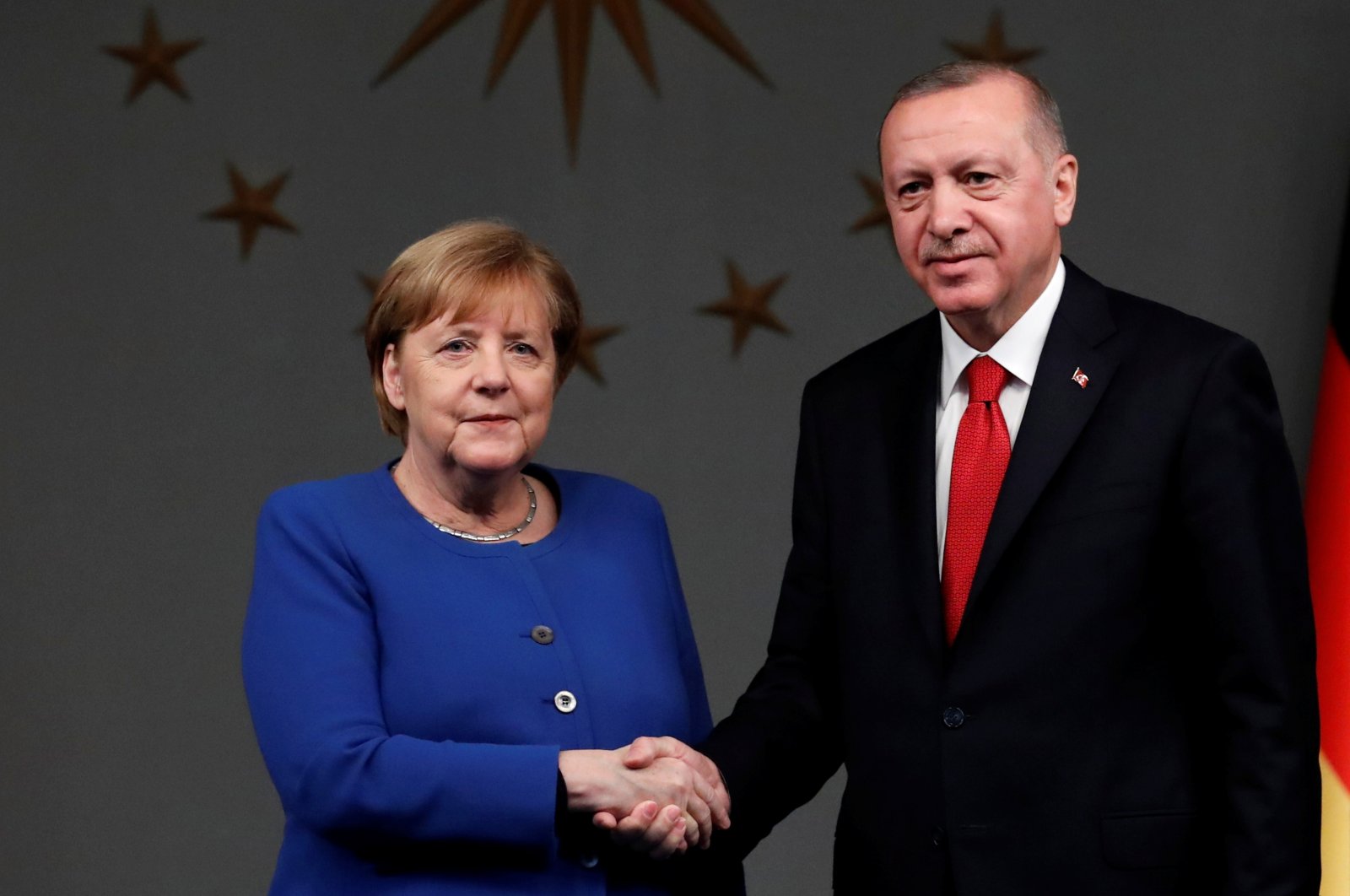 President Recep Tayyip Erdoğan and German Chancellor Angela Merkel shake hands after a joint news conference in Istanbul, Turkey, Jan. 24, 2020. (Reuters File Photo)