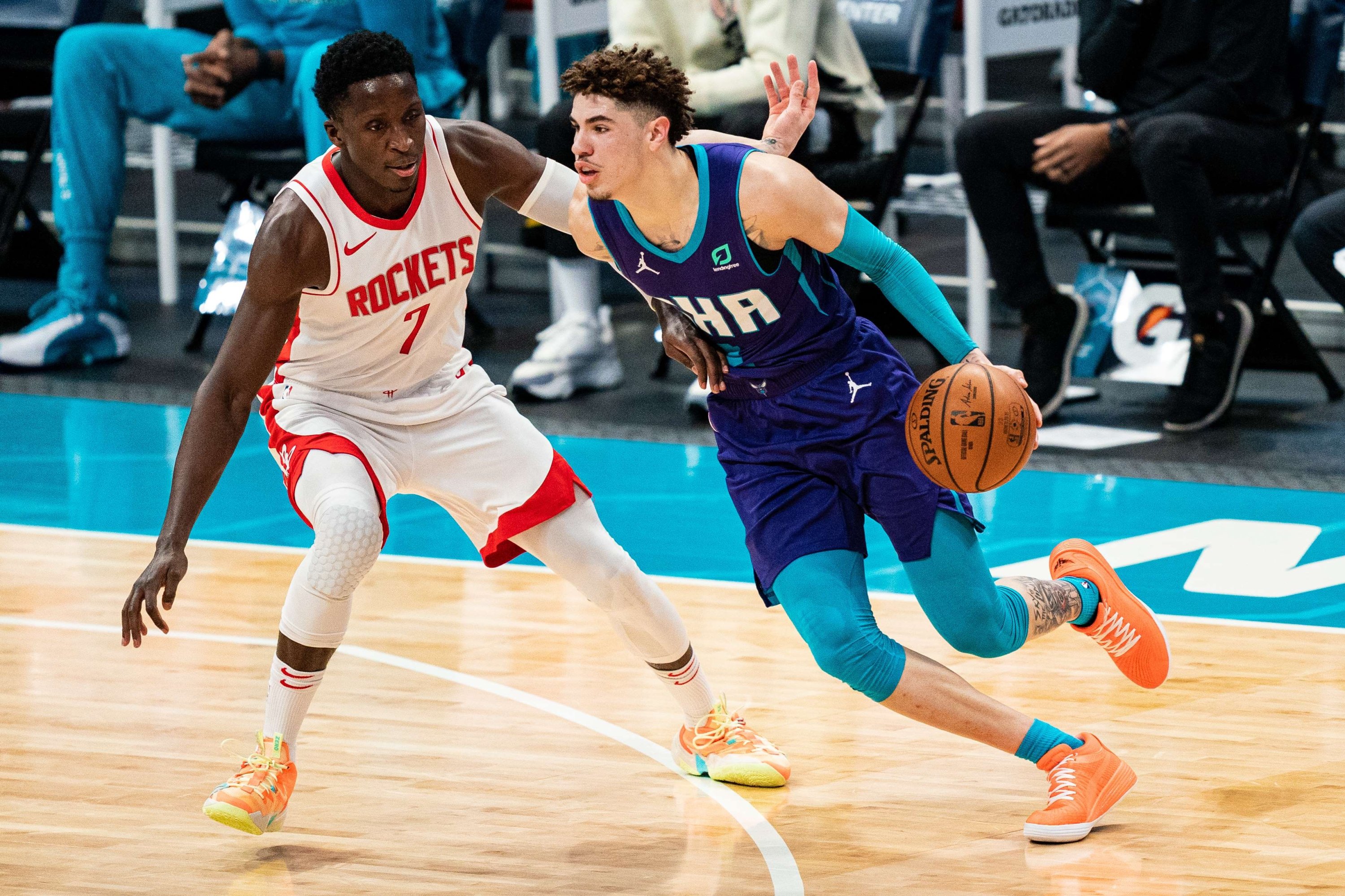 Charlotte Hornets LaMelo Ball (R) drives against Houston Rockets' Victor Oladipo (L) during their NBA match at Spectrum Center, Charlotte, North Carolina, U.S., Feb. 8, 2021. (AFP Photo)