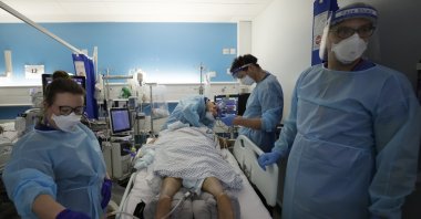 In this Wednesday, Jan. 27, 2021 file photo, Critical Care staff look after a COVID-19 patient on the Christine Brown ward at King's College Hospital in London. (AP Photo)